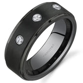 Black ring with three cubic zirconia on a white background